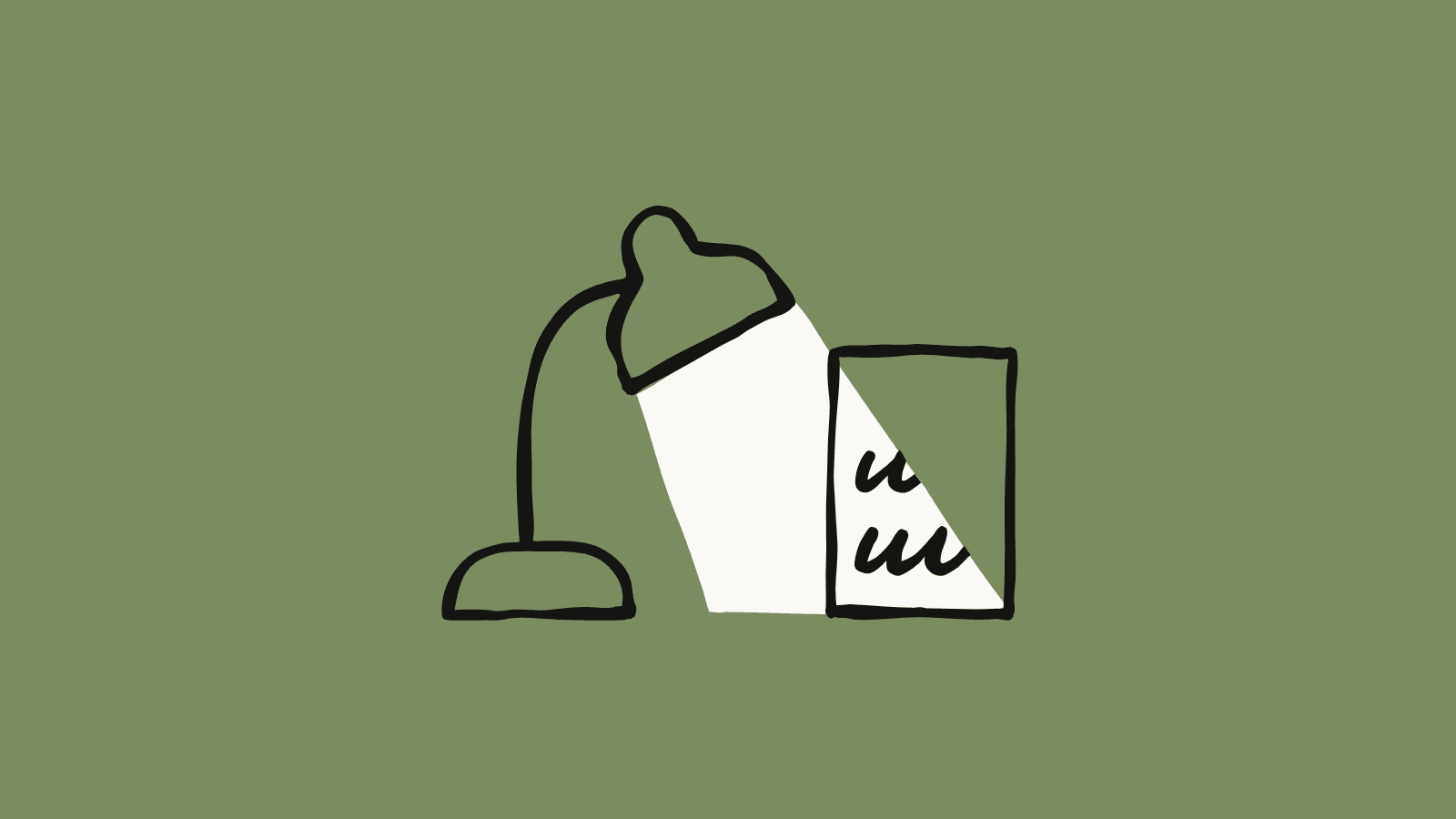 A desk lamp lighting a written page